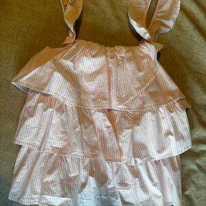 Very flattering white and pink pin stripe top with tiered ruffle detailing.